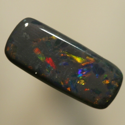 SOLID BLACK OPAL Sparkles of red between blues with a touch of gold